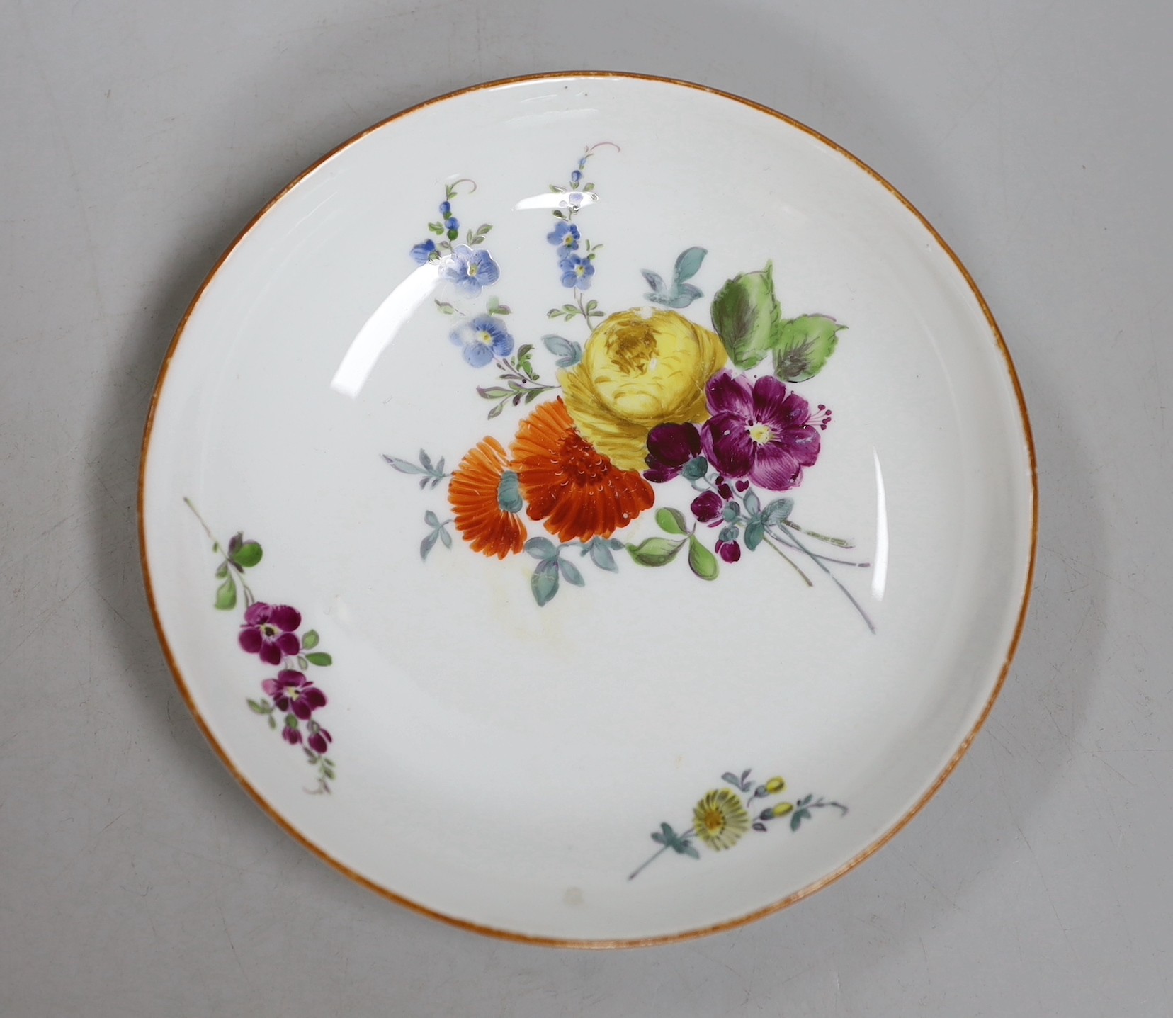 A Meissen dot period flower painted cup and saucer, c.1770